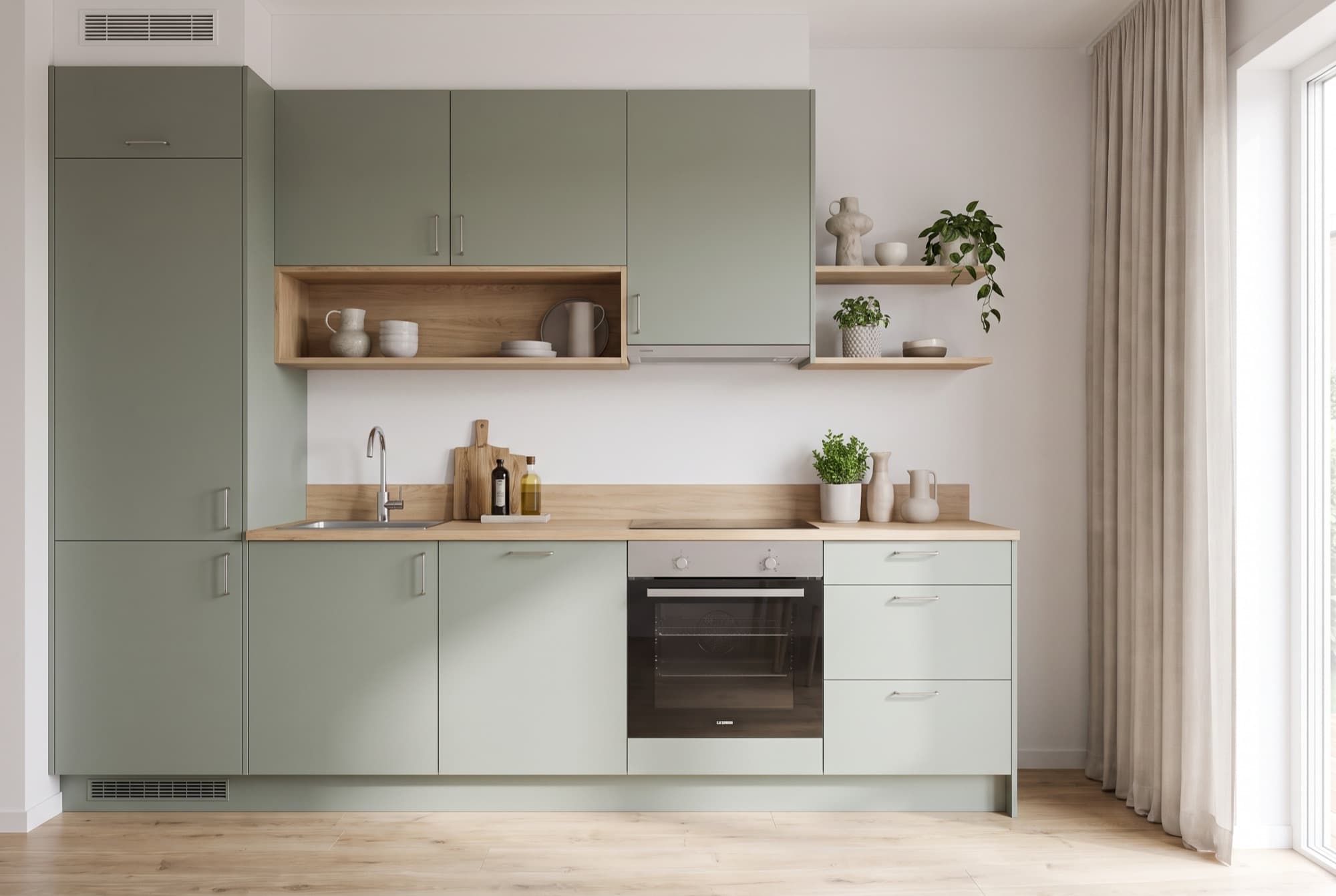 A1's sage-green fitted kitchenette with an oak worktop, open shelving and built-in oven