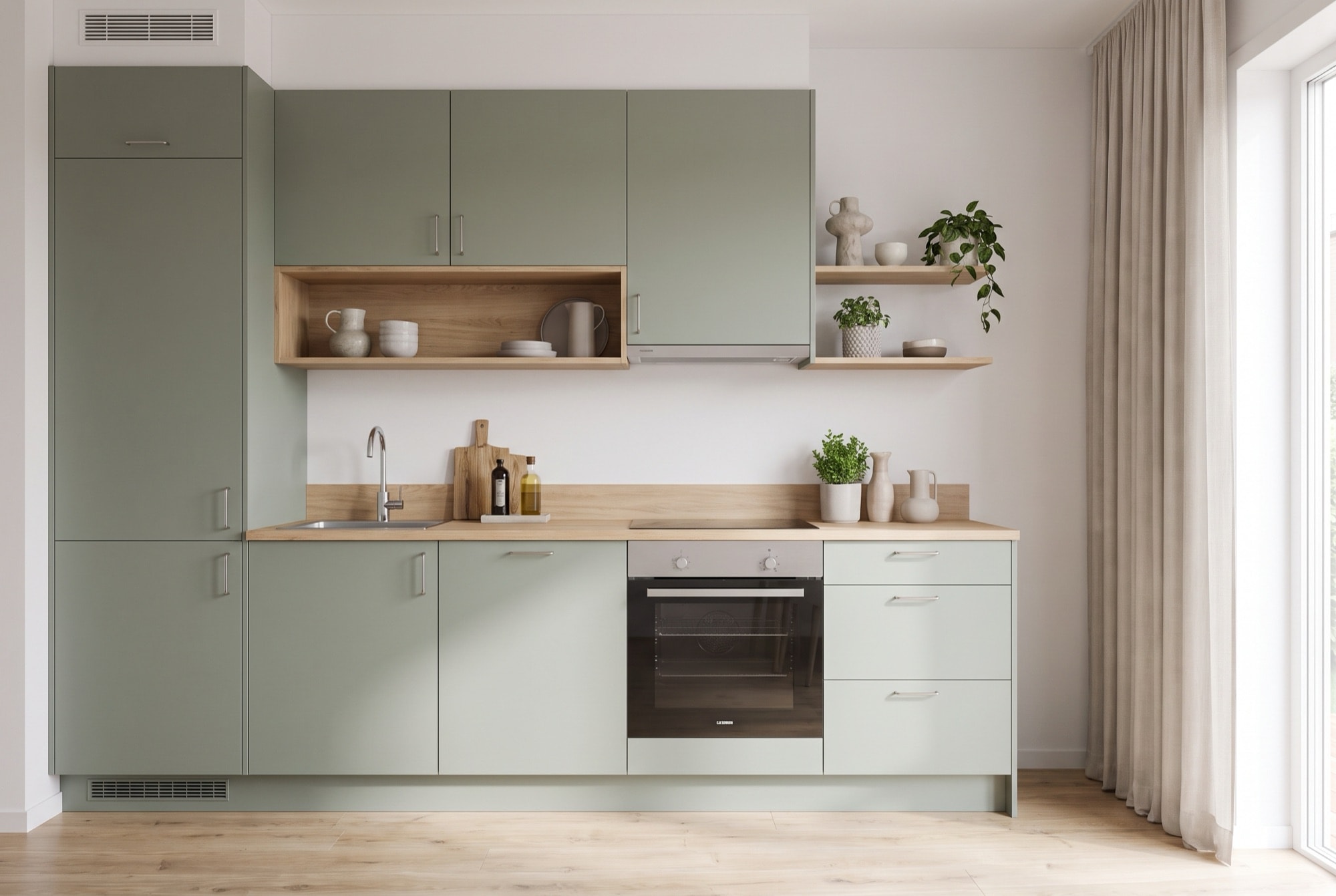 A1's sage-green fitted kitchenette with an oak worktop, open shelving and built-in oven